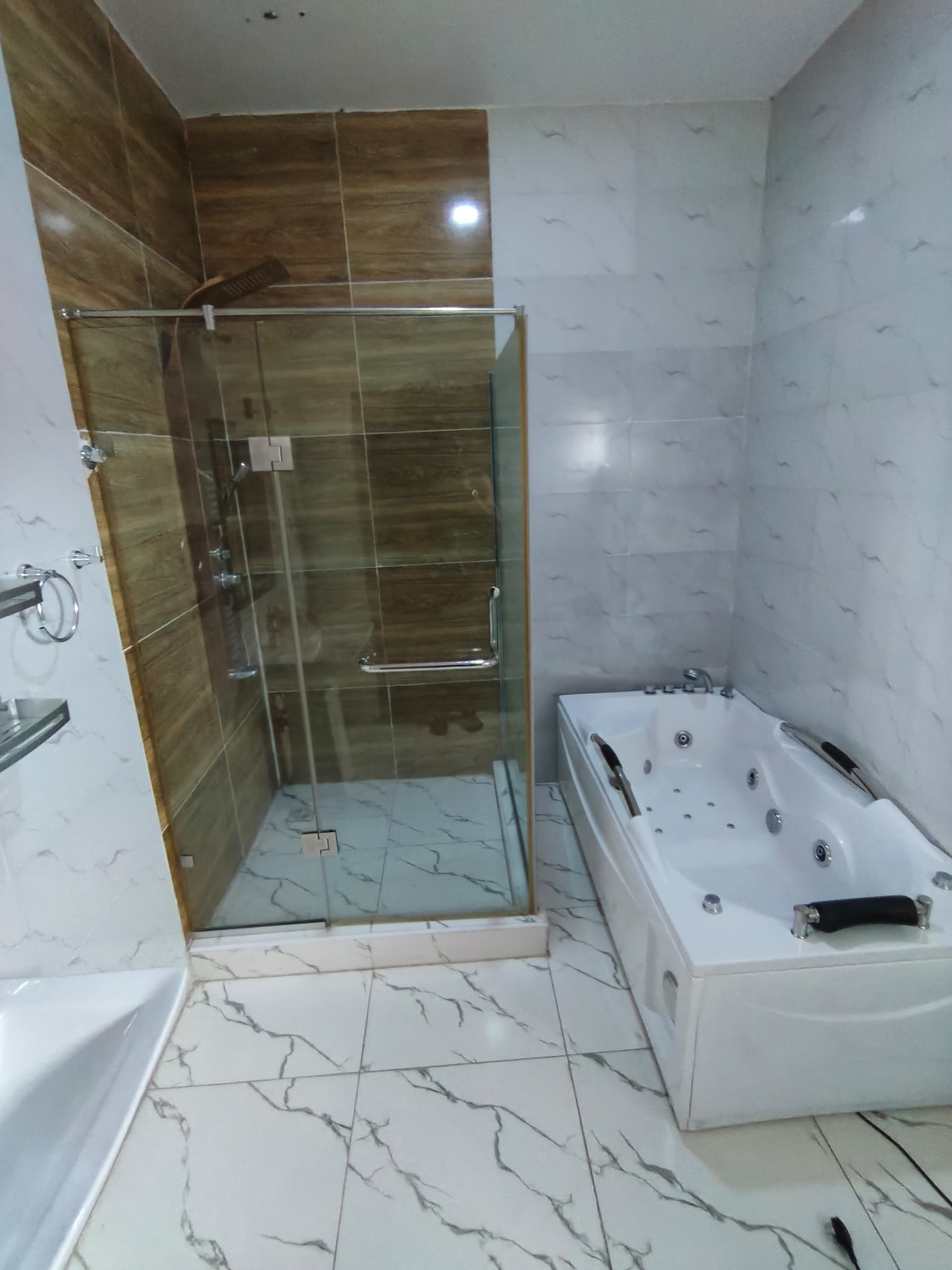Bathroom: shower enclosure and tub